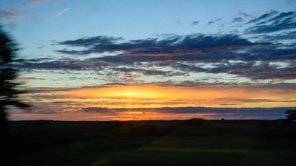 Glowing clouds at sunset, seen from a train on the North Wales Coast