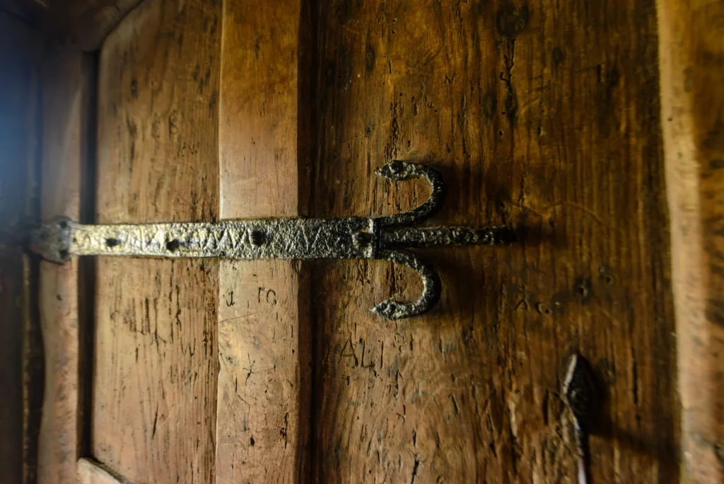 A 14th century wrought iron strap hinge, close detail, on the south door.